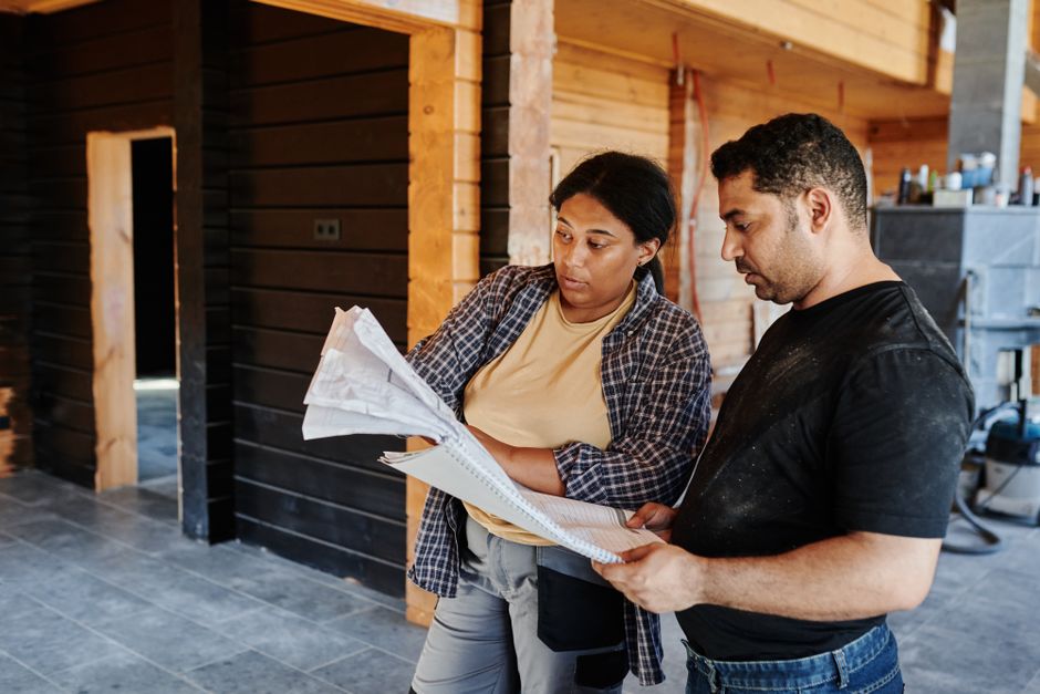 General contractor reviewing house blueprints and architectural plans